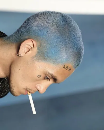 Blue buzzcut in profile